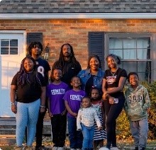 Family in front of house